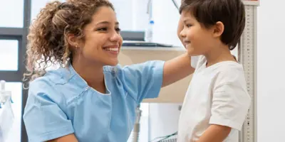 Nurse measures a child's height