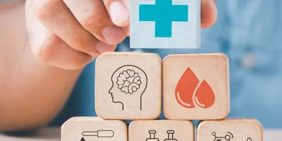 Nurse holds wooden health blocks