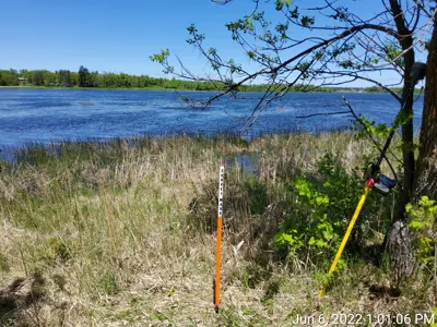Survey marker by a lake